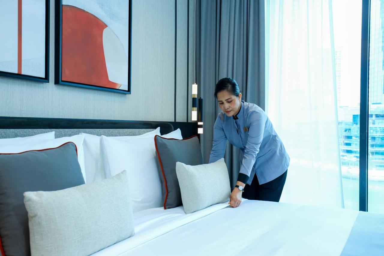 Charthouse Bahrain Hotel Manama Exterior photo A chambermaid making a bed