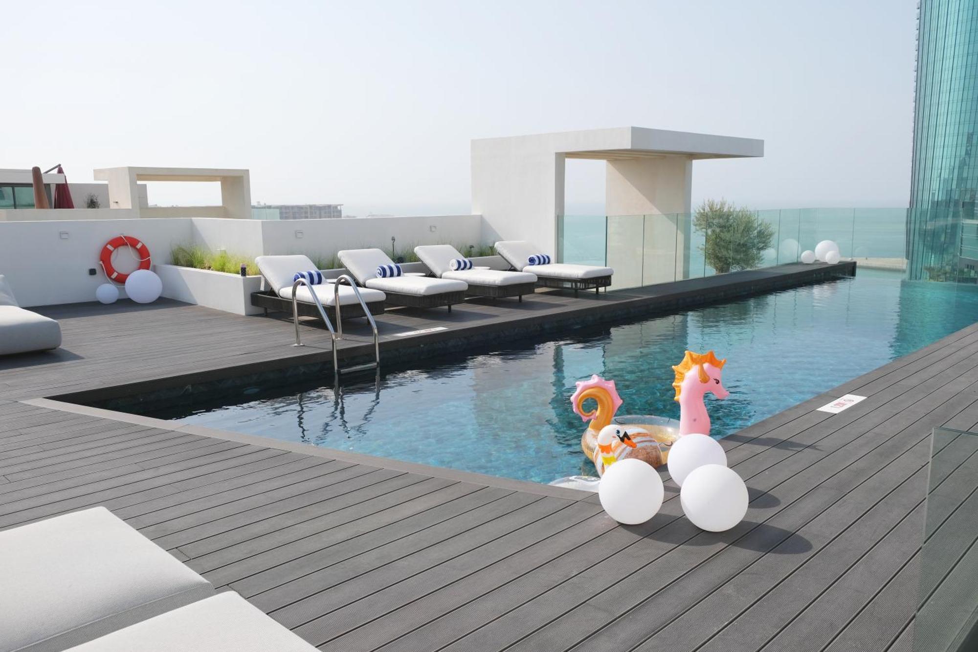 Charthouse Bahrain Hotel Manama Exterior photo The pool at the top of the hotel